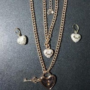 Juicy Couture tiered necklace with set of matching earrings.